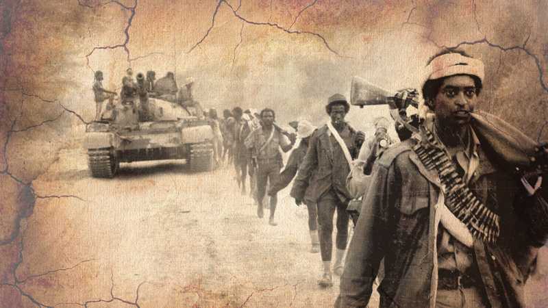 EPLF freedom fighters on the march with a tank unit