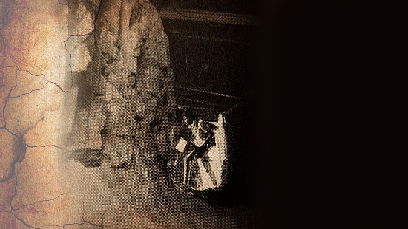 EPLF freedom fighter looking out from a shell-proof dugout